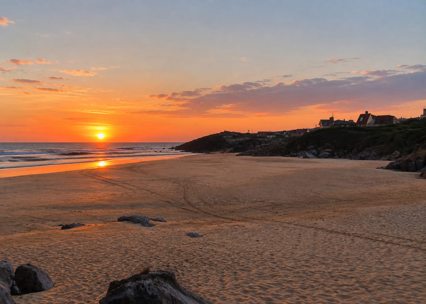 September sunset over an empty Playa de Ajo, golden tones