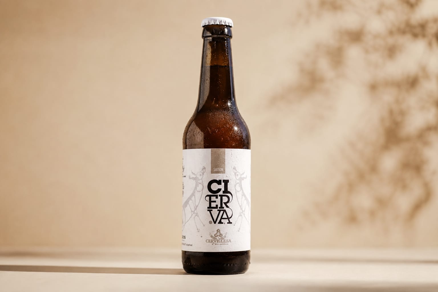 Bottle and glass of La Cierva beer from Cerveceros del Asón on a wooden table, brewery workshop setting