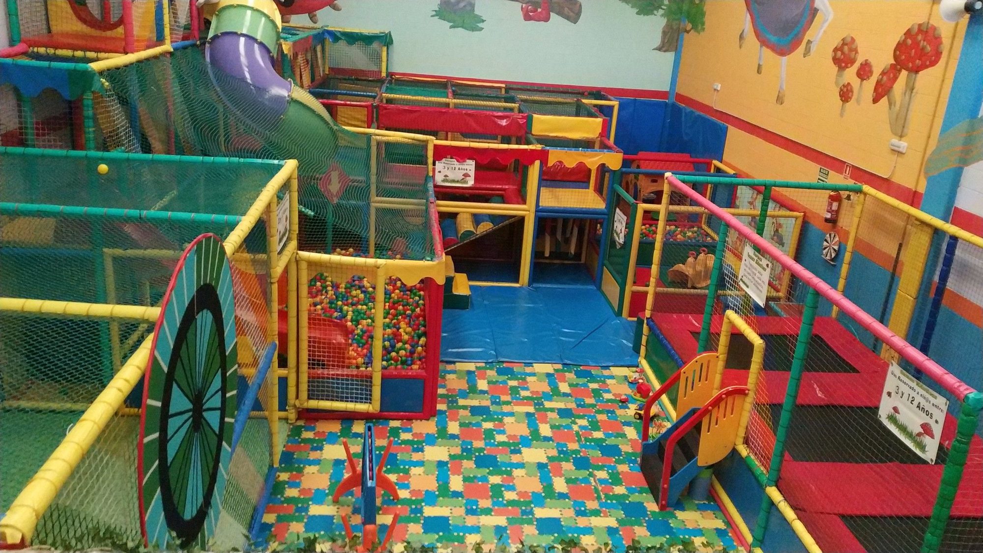 Interior of Kokopark in Igollo de Camargo: ball pit and slides during a children's party