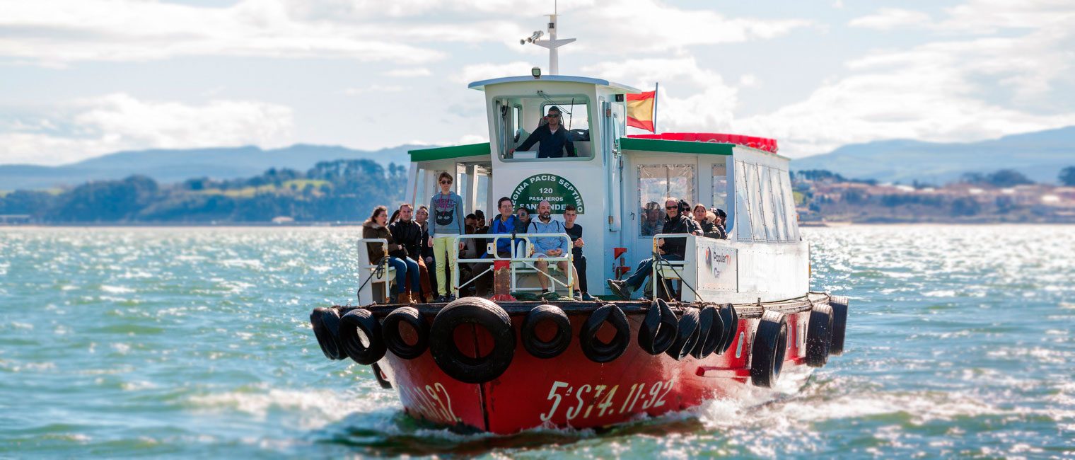 Passenger ferry crossing Santander Bay towards Somo, with the city of Santander in the background