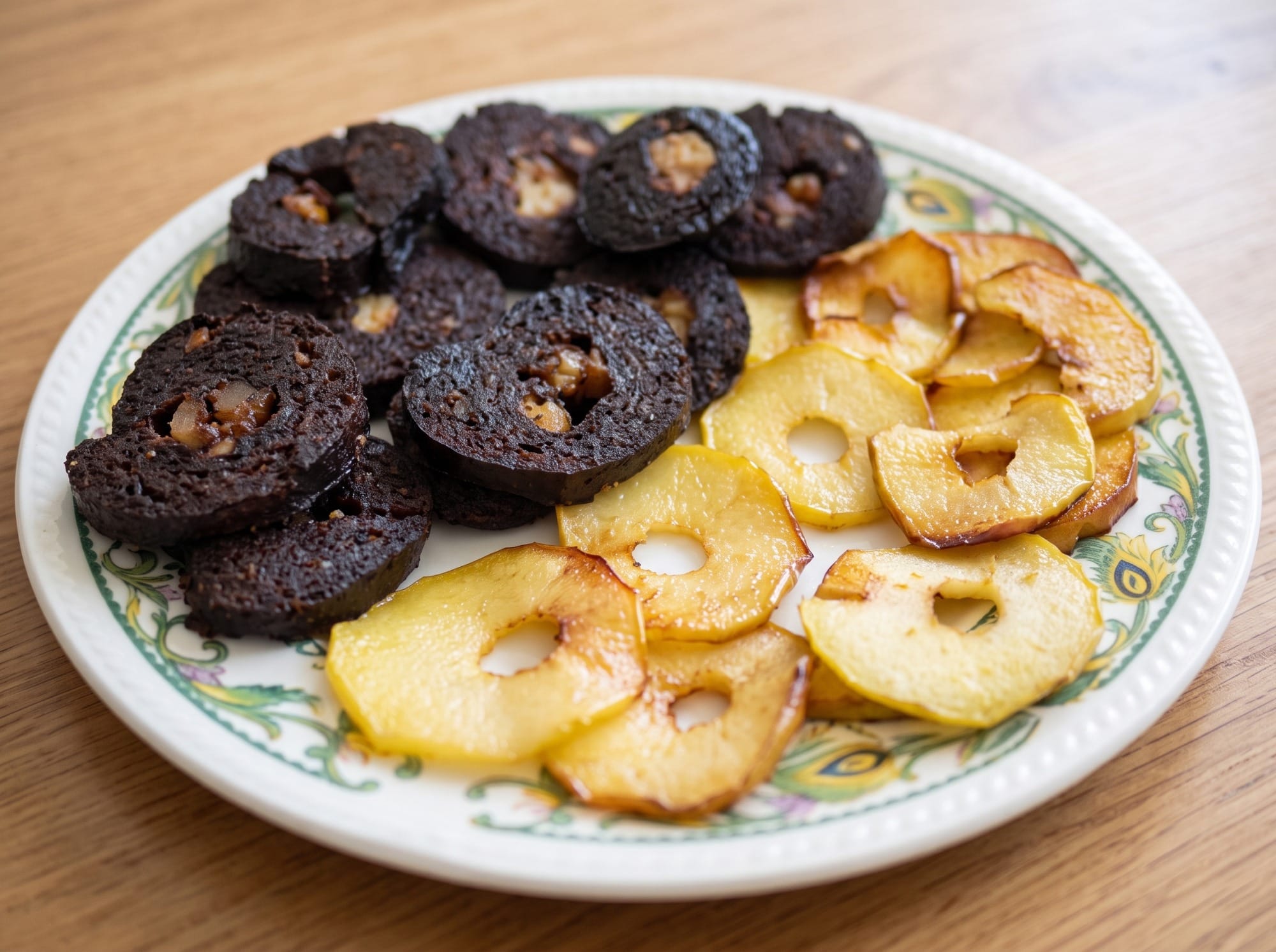 Plate of fried borono with fried apple and a glass of cold milk