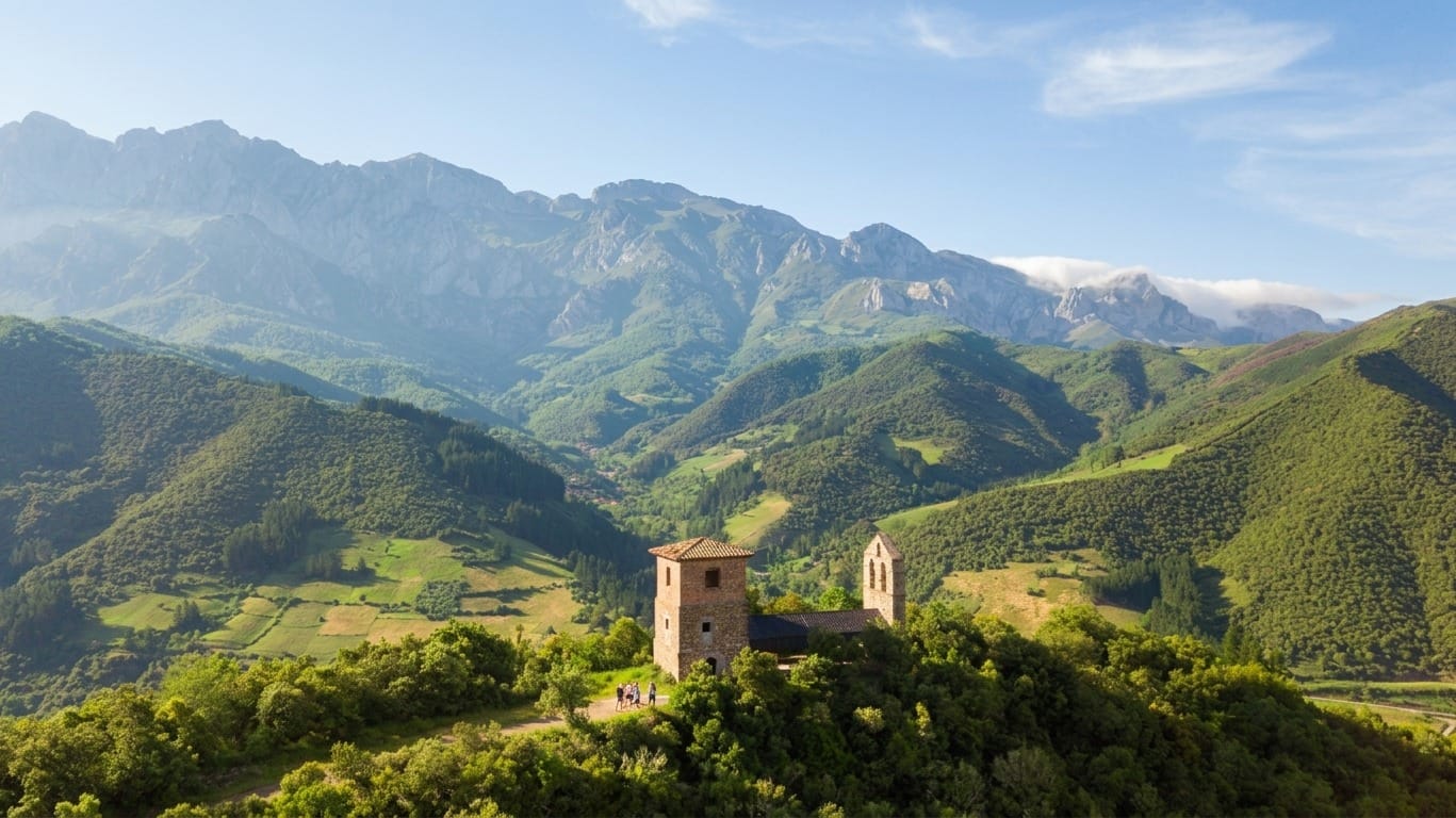 Street in Potes, Liébana, with stone houses and mountains in the background