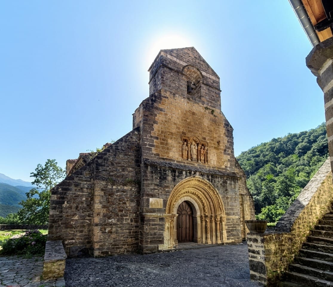 Romanesque portal and capitals of the church of Santa María de Piasca, afternoon side light