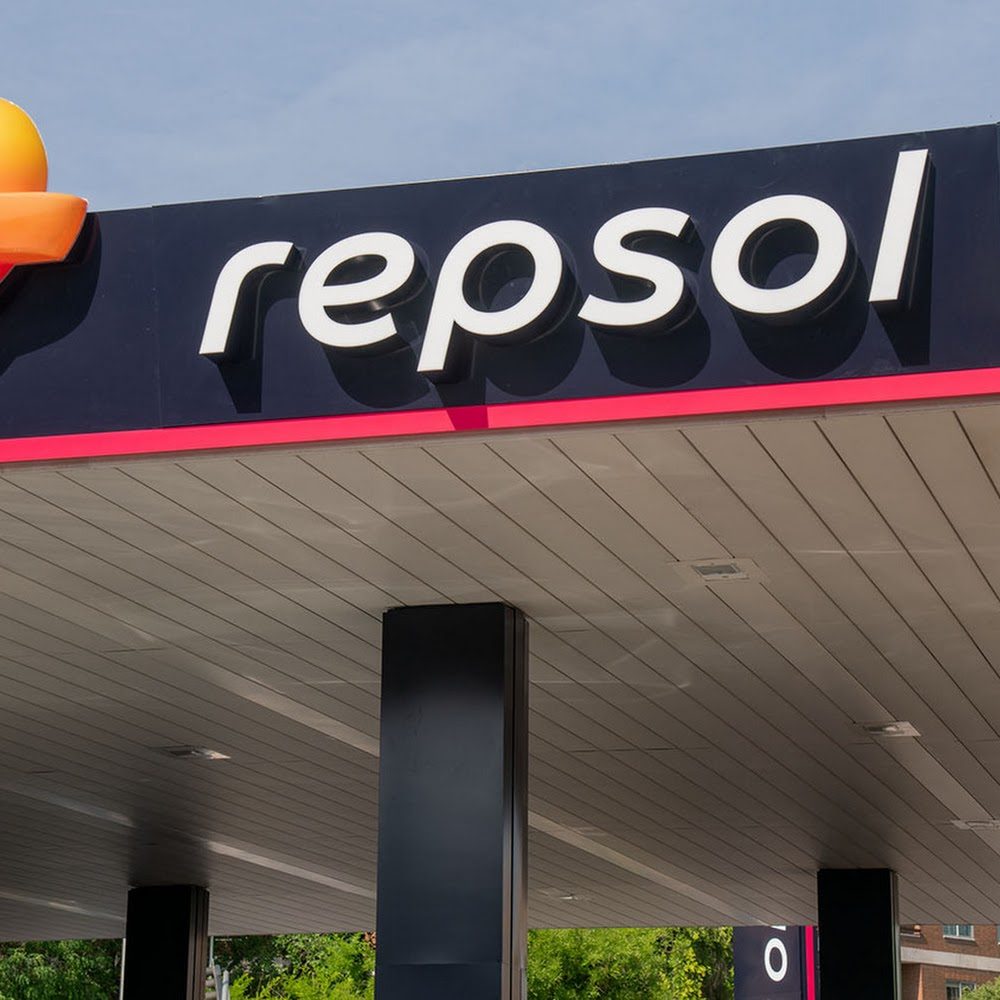Fuel pumps at a Repsol roadside petrol station in Cantabria, on a cloudy day